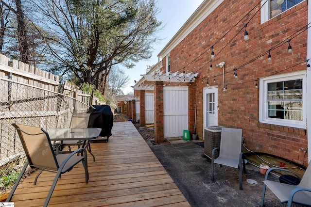 deck featuring a pergola and grilling area