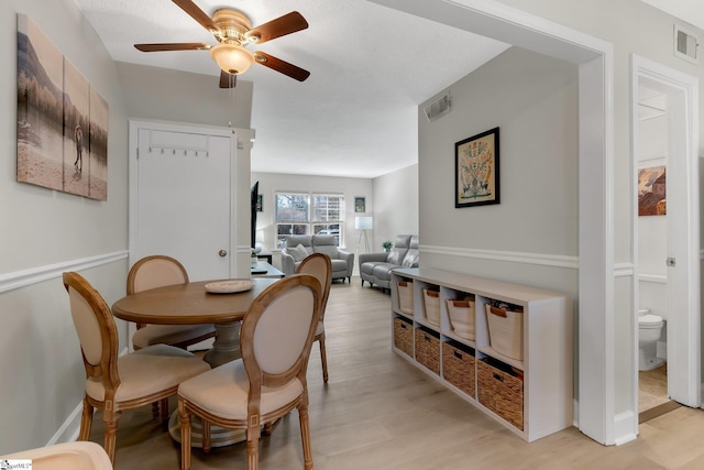 dining area featuring ceiling fan and light hardwood / wood-style floors