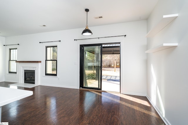 unfurnished living room featuring hardwood / wood-style flooring