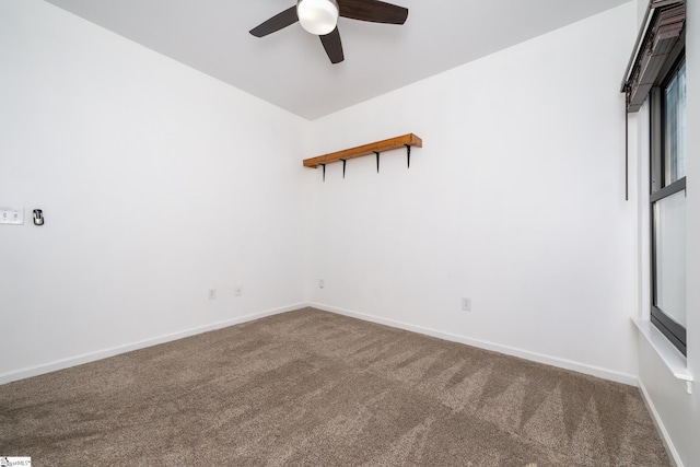 carpeted empty room featuring ceiling fan