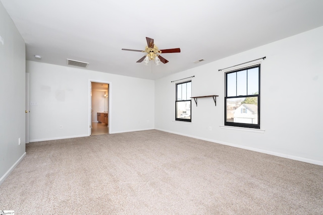 unfurnished room with carpet and ceiling fan