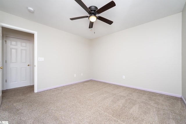 spare room featuring carpet floors and ceiling fan