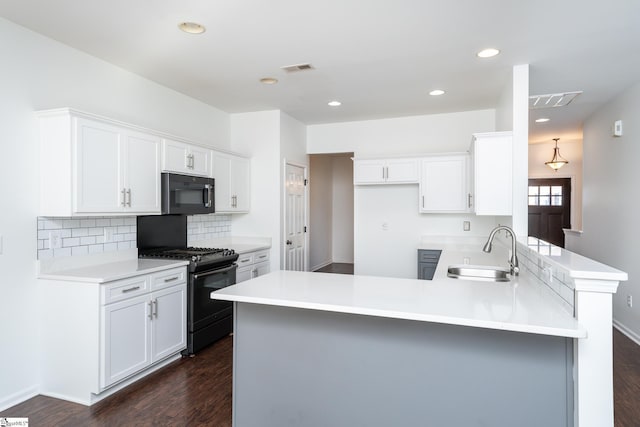 kitchen with white cabinetry, sink, and black appliances