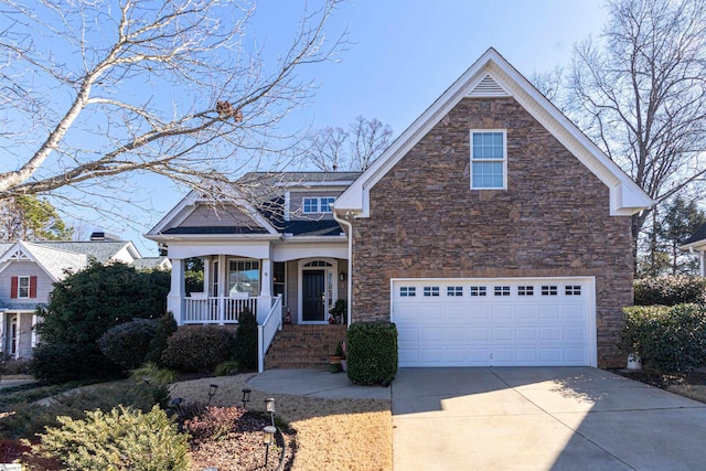 view of front of house with a garage and a porch