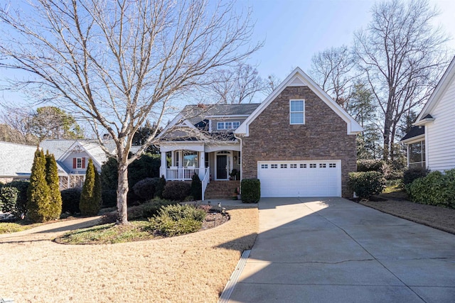 view of front of house featuring a porch and a garage