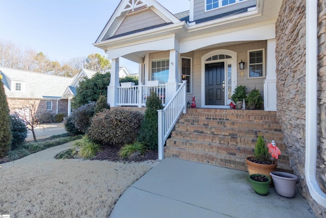 property entrance with covered porch