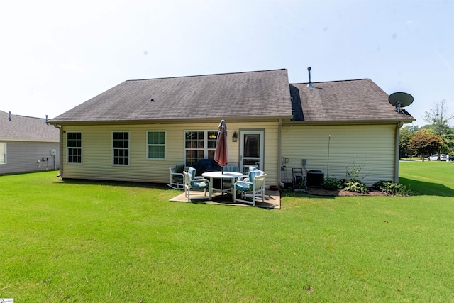 back of property featuring a yard and a patio area