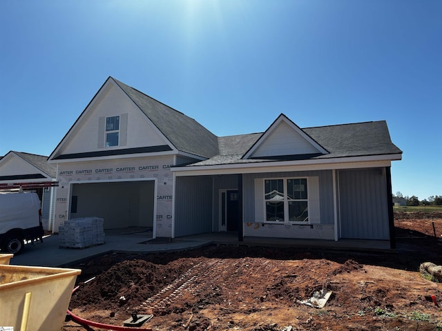 view of front of house featuring a garage and covered porch