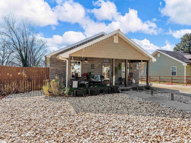 back of house featuring covered porch