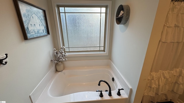 bathroom with a tub to relax in