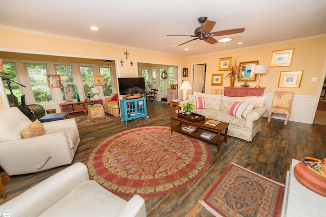 living room with ceiling fan, ornamental molding, and dark hardwood / wood-style floors