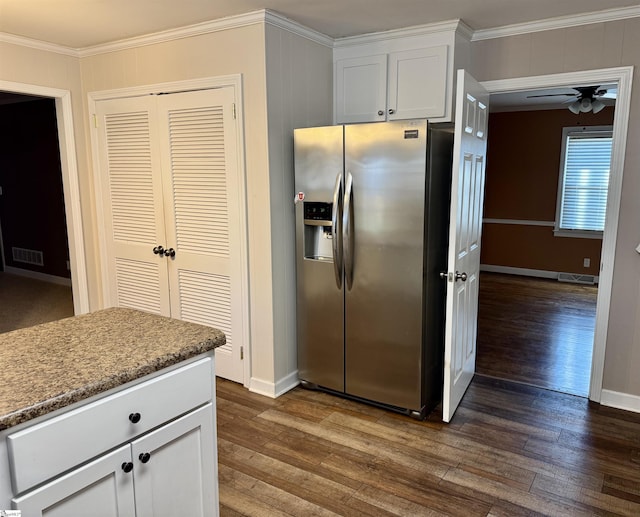 kitchen with stainless steel refrigerator with ice dispenser, ornamental molding, white cabinets, and dark hardwood / wood-style floors