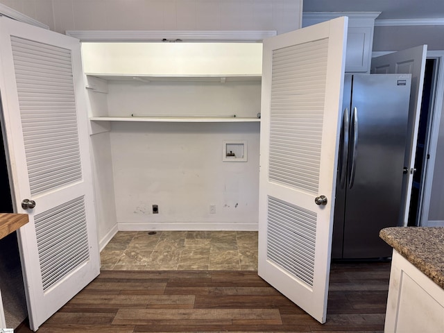 laundry room featuring dark hardwood / wood-style floors and washer hookup