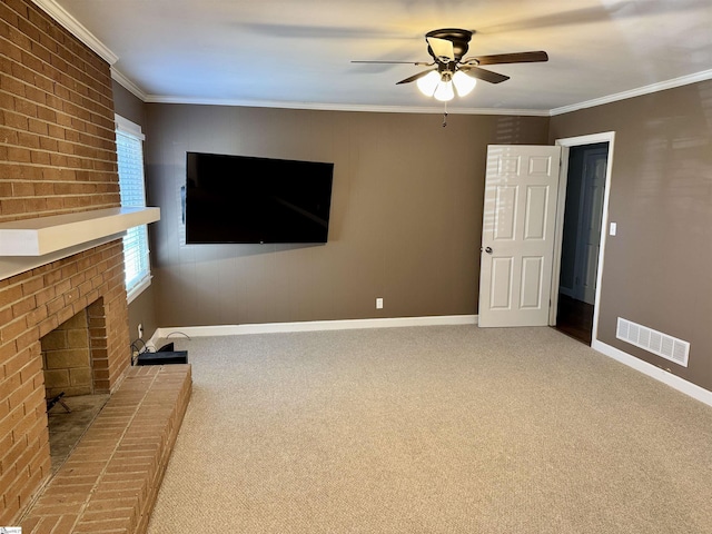 unfurnished living room featuring crown molding, a fireplace, and carpet