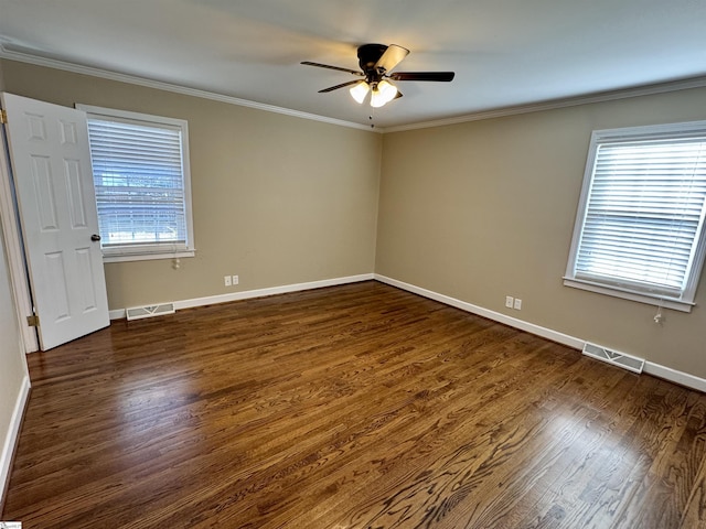 unfurnished room with crown molding, dark hardwood / wood-style floors, and ceiling fan