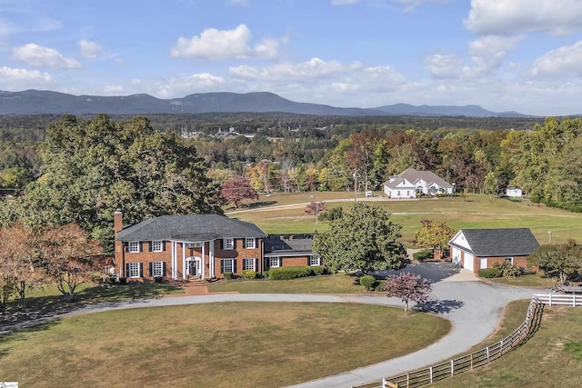 birds eye view of property featuring a mountain view