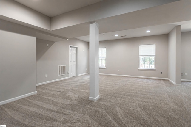 basement with light colored carpet