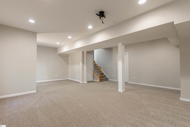 basement with light colored carpet