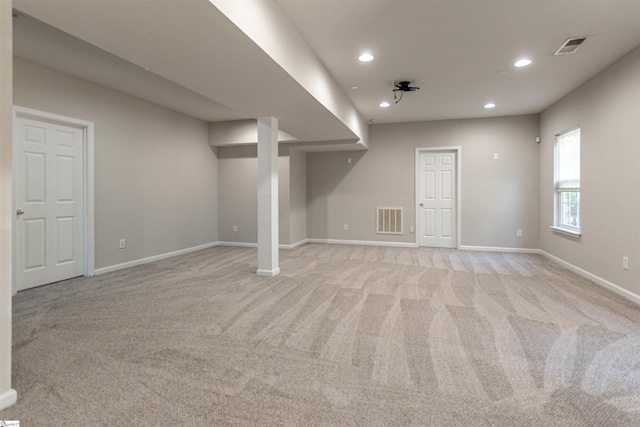 basement with light colored carpet