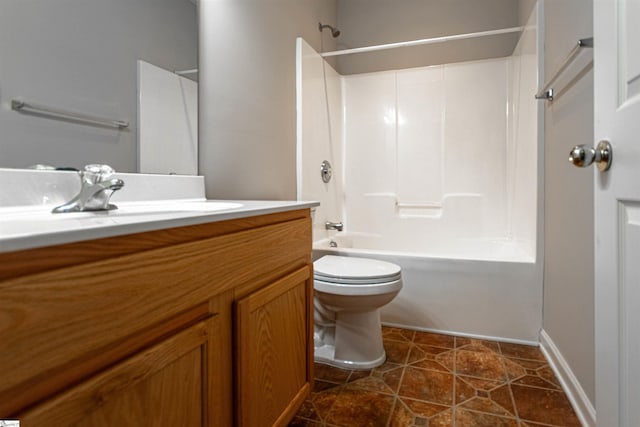 full bathroom with vanity, tile patterned floors, washtub / shower combination, and toilet