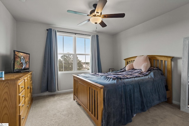 bedroom with light colored carpet and ceiling fan