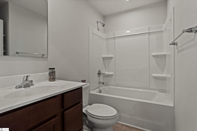 full bathroom featuring tile patterned flooring, bathing tub / shower combination, vanity, and toilet