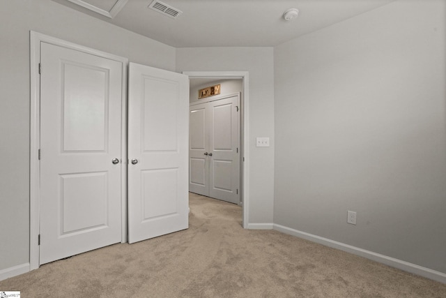 unfurnished bedroom with light carpet