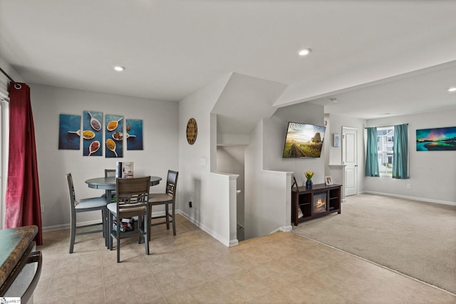 dining room featuring light colored carpet