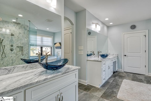 bathroom with vanity and an enclosed shower