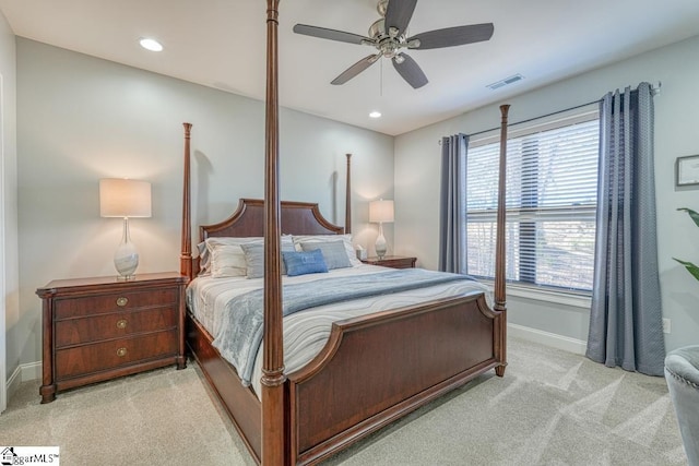 bedroom with light carpet and ceiling fan