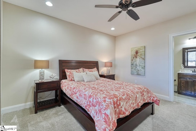 carpeted bedroom featuring ceiling fan and connected bathroom