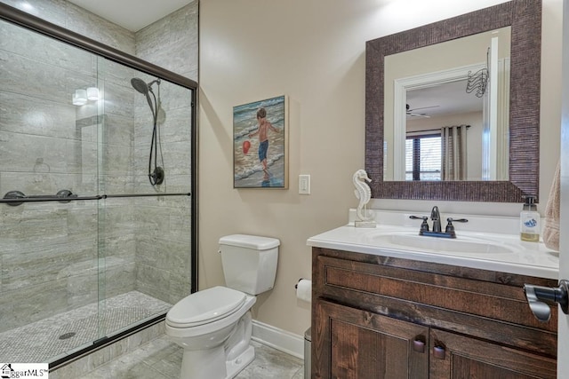 bathroom featuring vanity, toilet, and walk in shower