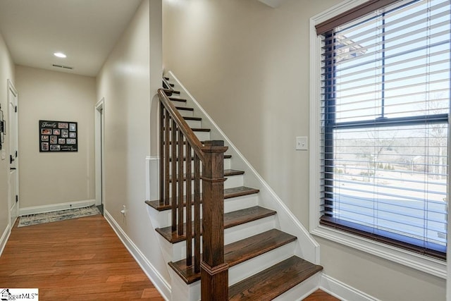 staircase featuring wood-type flooring