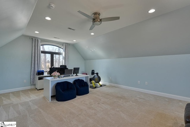 carpeted office with ceiling fan and vaulted ceiling