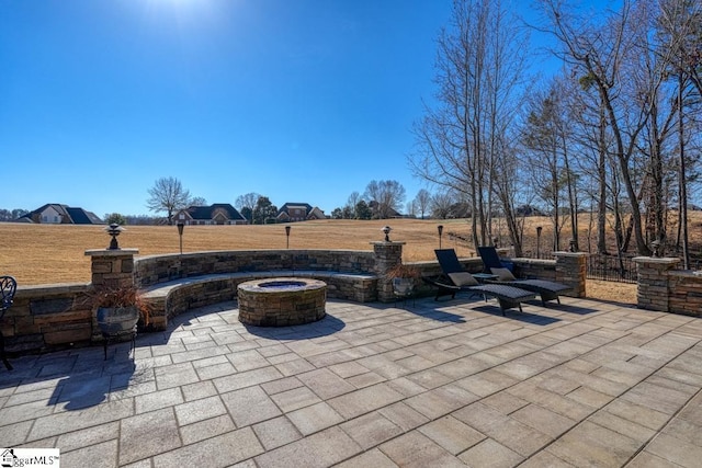 view of patio / terrace with a fire pit