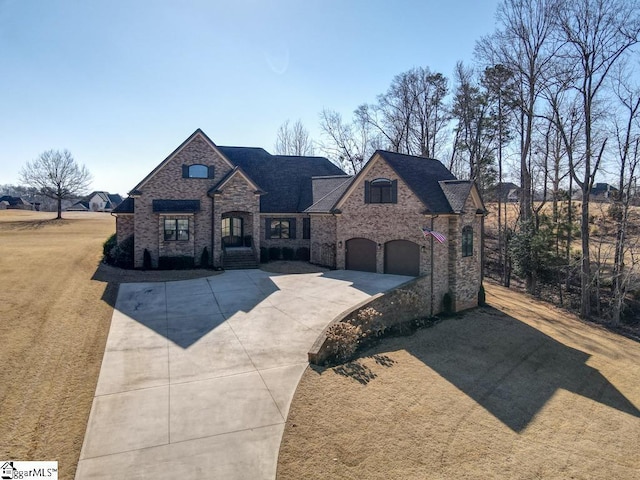 french country inspired facade with a garage and a front lawn