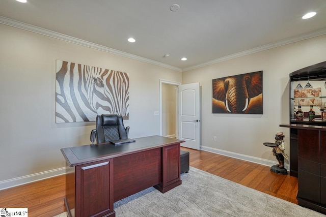 office featuring crown molding and light wood-type flooring