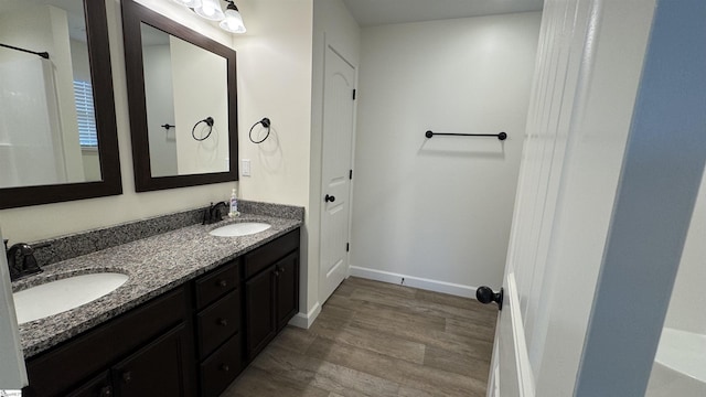 bathroom featuring vanity and hardwood / wood-style floors