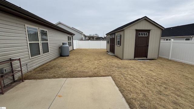 view of yard featuring a patio and a storage unit