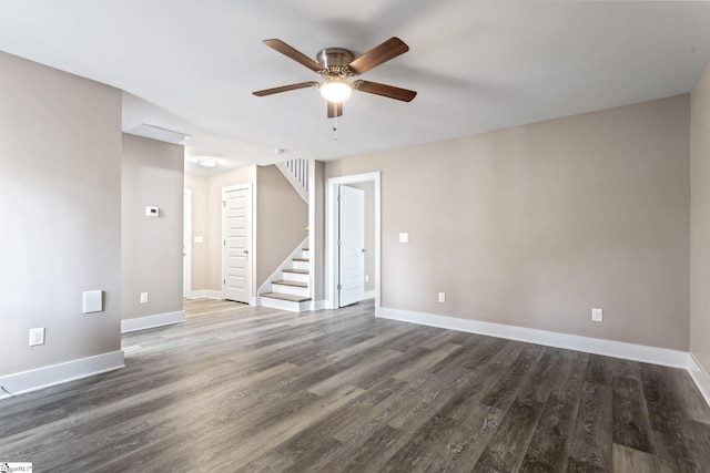 empty room featuring dark wood-type flooring and ceiling fan