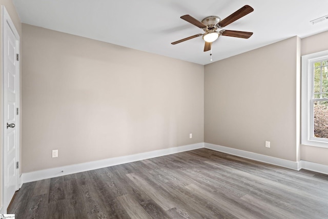 spare room featuring hardwood / wood-style flooring and ceiling fan