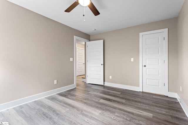 unfurnished room featuring wood-type flooring and ceiling fan