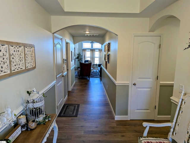 hall with dark wood-type flooring