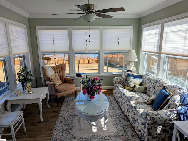 sunroom featuring ceiling fan and a wealth of natural light