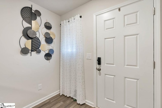 foyer with dark hardwood / wood-style flooring