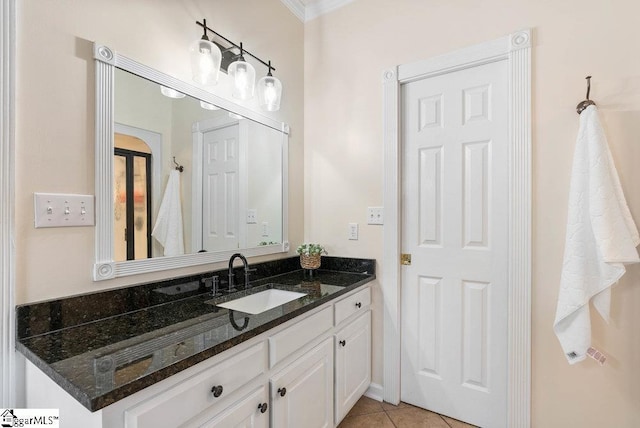 bathroom featuring tile patterned flooring and vanity