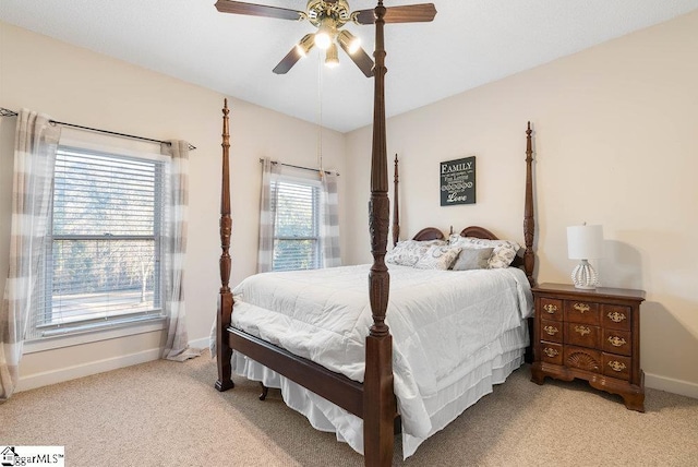 carpeted bedroom with lofted ceiling and ceiling fan