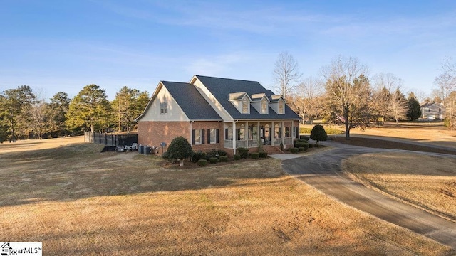 view of front of home featuring a front yard and a porch