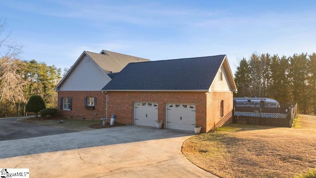 view of property exterior featuring a garage