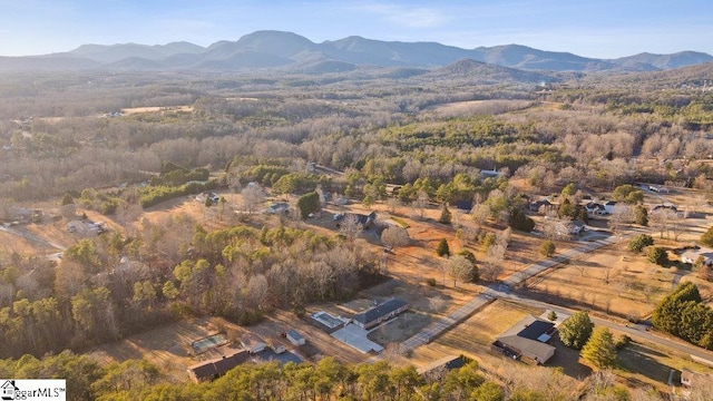 birds eye view of property with a mountain view